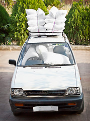 Image showing Old car, good staffing of airbags. Joke.