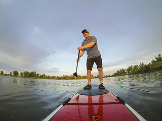 Image showing stand up paddling