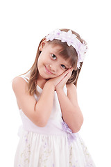 Image showing happy smiling little girl on white background in studio 