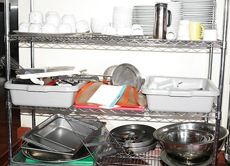 Image showing Variety of kitchen utensils on counter