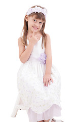 Image showing A portrait of a cheerful little girl on the white background 