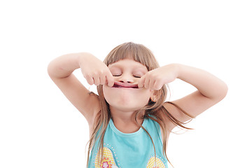 Image showing Little girl making funny face, isolated on white