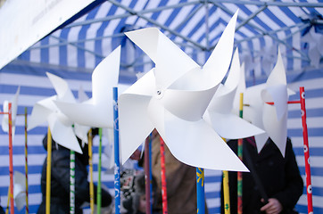 Image showing paper windmill  donation charity event poor kids 