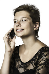 Image showing Girl phoning with cellphone in the evening dress