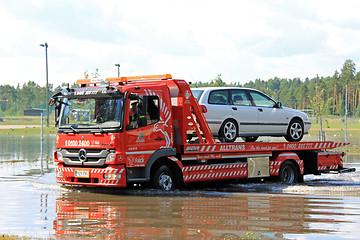 Image showing Tow Truck Rescuing Car From Flood