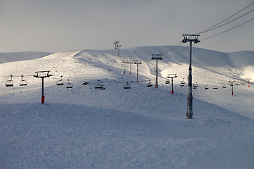 Image showing Ski slope with chair-lift in evening