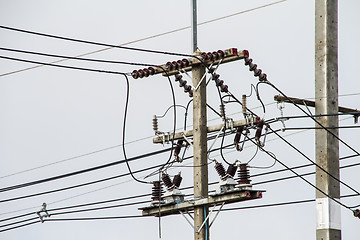 Image showing Concrete pole with power lines and insulators.