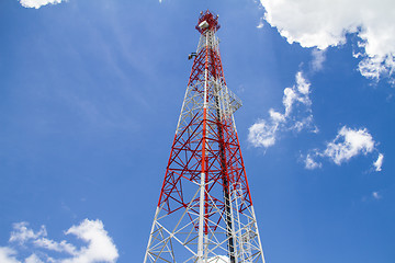 Image showing Telecommunications tower with blue sky and cloud