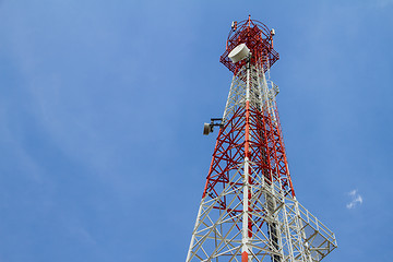 Image showing Telecommunications tower with blue sky and cloud