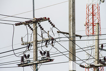 Image showing Concrete pole with power lines and insulators.