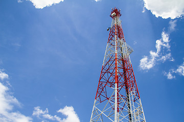 Image showing Telecommunications tower with blue sky and cloud