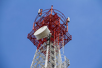 Image showing Telecommunications tower with blue sky and cloud