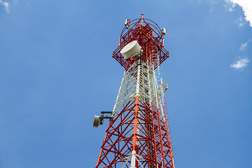 Image showing Telecommunications tower with blue sky and cloud