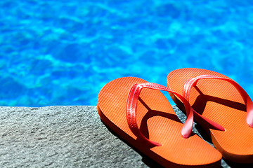 Image showing sandals by a pool