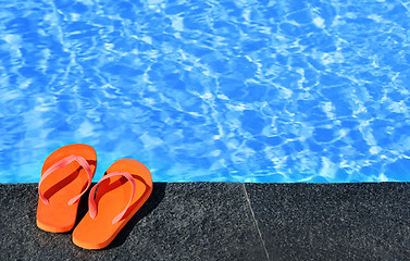 Image showing sandals by a pool