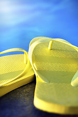 Image showing sandals by a pool