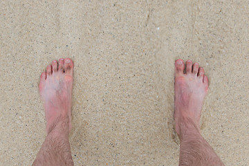Image showing Feet standing still on a beach