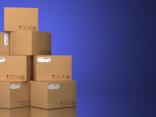 Image showing Pile of cardboard boxes on a blue background.