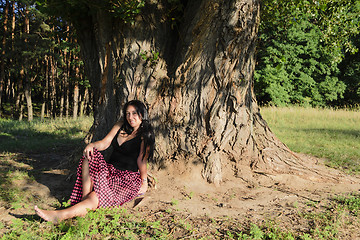 Image showing A girl under the tree