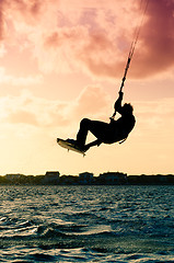 Image showing Silhouette of a kitesurfer flying