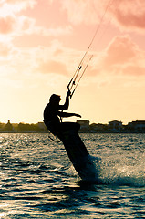 Image showing Silhouette of a kitesurfer flying