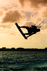 Image showing Silhouette of a kitesurfer flying