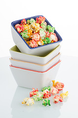 Image showing Pile of ceramic bowls of popcorn