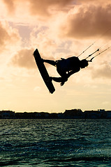 Image showing Silhouette of a kitesurfer flying