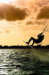 Image showing Silhouette of a kitesurfer flying