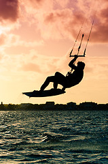 Image showing Silhouette of a kitesurfer flying