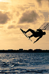 Image showing Silhouette of a kitesurfer flying