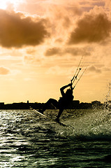 Image showing Silhouette of a kitesurfer flying