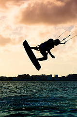 Image showing Silhouette of a kitesurfer flying