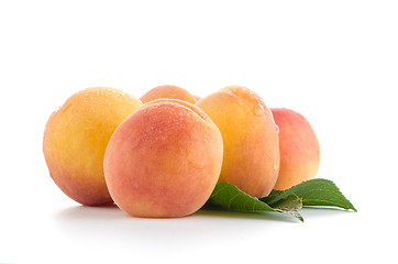 Image showing Sweet peaches with leafs