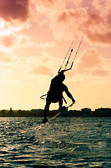 Image showing Silhouette of a kitesurfer flying