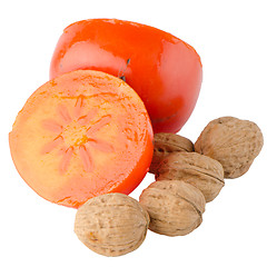 Image showing Ripe persimmons and nuts