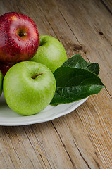 Image showing Apples in a ceramic white plate