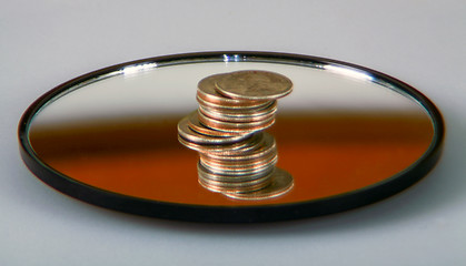 Image showing Quarters on a mirror