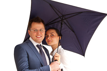 Image showing business couple under an umbrella