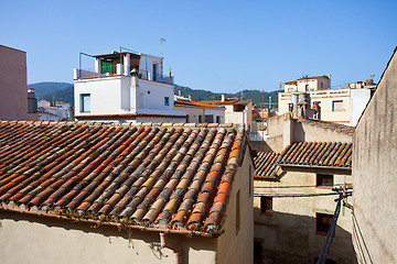 Image showing red tiles on the roof of an old house