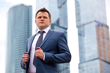 Image showing Businessman near office towers