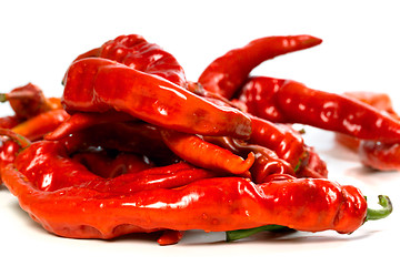 Image showing Red chili peppers with water drops on white background