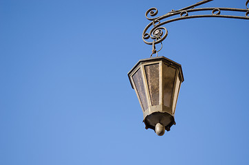 Image showing retro iron light lamp background dark blue sky 