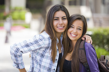 Image showing Mixed Race Female Students Carrying Backpacks on School Campus