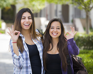 Image showing Mixed Race Female Students on School Campus With Okay Sign