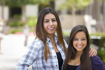 Image showing Mixed Race Female Students Carrying Backpacks on School Campus