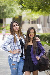 Image showing Mixed Race Female Students Carrying Backpacks on School Campus