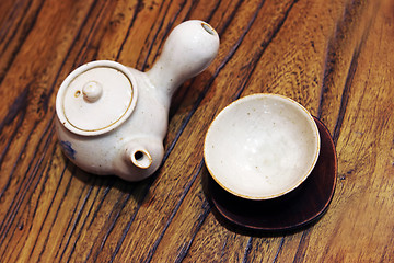 Image showing Pottery tea pot and cup