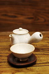 Image showing Pottery tea pot and cup