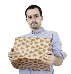 Image showing Young man holding a present